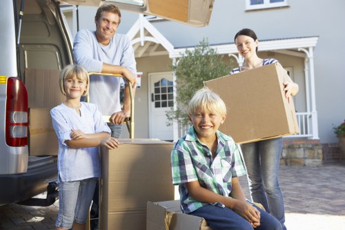 Professional movers handling apartment access during flat removals in Addington