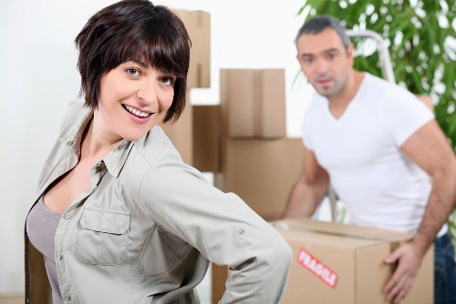 Professional removals team loading furniture for an Addington move